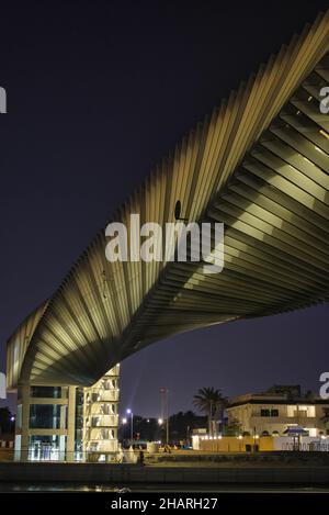 Dubai Water Canal pedestrian bridge in United Arab Emirates at night Stock Photo