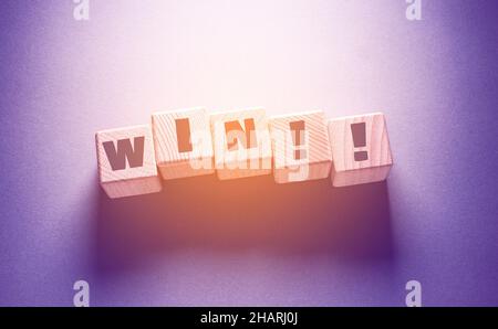 Win Word Written on Wooden Cubes Stock Photo