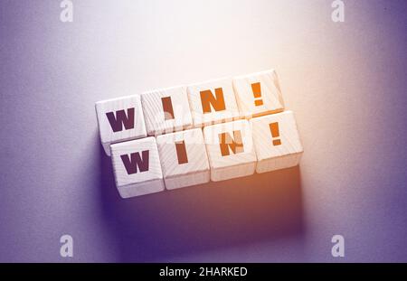 Win Word Written on Wooden Cubes Stock Photo