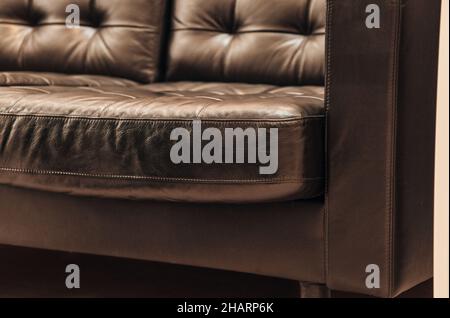 Elegant brown sofa made of genuine leather Stock Photo