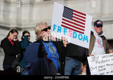 Harrisburg, United States. 14th Dec, 2021. Protesters hold placards during a protest against vaccine mandates held at the Pennsylvania State Capitol. People gathered on the steps of the Pennsylvania State Capitol to protest against COVID-19 vaccine mandates. Credit: SOPA Images Limited/Alamy Live News Stock Photo