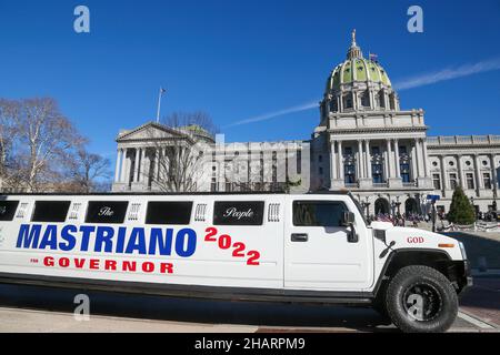 Harrisburg, United States. 14th Dec, 2021. A Hummer stretch limousine is parked at the Pennsylvania State Capitol during the Doug Mastriano's rally against vaccine mandates. People gathered on the steps of the Pennsylvania State Capitol to protest against COVID-19 vaccine mandates. Credit: SOPA Images Limited/Alamy Live News Stock Photo