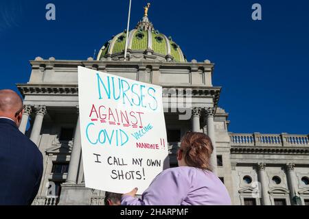 Harrisburg, United States. 14th Dec, 2021. A protester holds a placard during a rally against vaccine mandates held at the Pennsylvania State Capitol. People gathered on the steps of the Pennsylvania State Capitol to protest against COVID-19 vaccine mandates. Credit: SOPA Images Limited/Alamy Live News Stock Photo