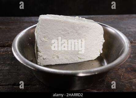 Tehatta, West Bengal, India. 13th Dec, 2021. 'Paneer', also known as 'ponir' or Indian cottage cheese, is a fresh acid-set cheese common in the Indian subcontinent (Bangladesh, Bhutan, India, Maldives, Nepal, Pakistan and Sri Lanka) made from cow or buffalo milk at Tehatta. (Credit Image: © Soumyabrata Roy/Pacific Press via ZUMA Press Wire) Stock Photo