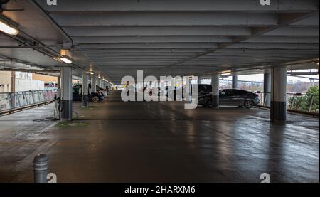 Parking interior. Parking garage in New Westminster BC. Multi-storey car park. Street photo, selective focus Stock Photo