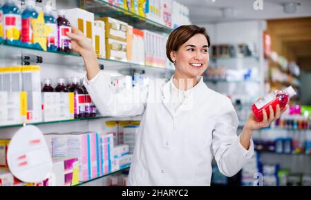 Female pharmacist suggesting useful body care products Stock Photo