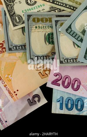 Turkish Money and American Dollar Bills on black background with copy space,vertical image Stock Photo