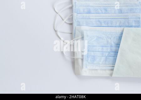 Three ply structure,single use hygenic face mask on white background with copy space. Stock Photo