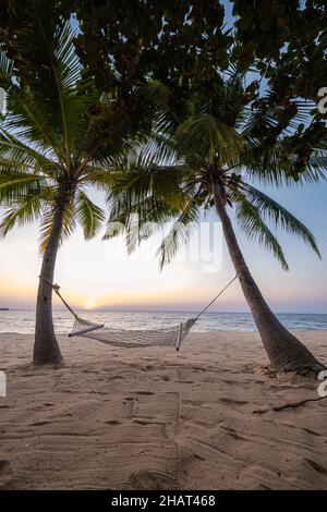 NaJomtien Pattaya Thailand, Hammock on the beach during sunset with palm trees. Na Jomtien Pattaya Stock Photo