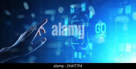GO green eco technology ecology earth planet saving alternative energy. Button on virtual screen. Stock Photo