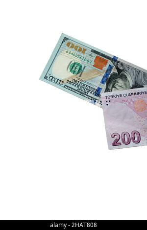 One Hundred Usa Dollar and Turkish Two Hundred Liras isolated on white surface.This image can be used horizontally or vertically Stock Photo