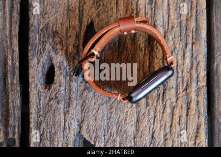 Smart watch with genuine leather hand craftsmanship on wood table handmade working Stock Photo