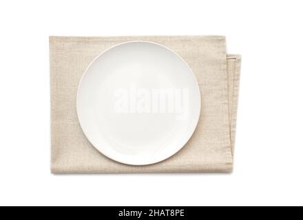 Plate mockup, ceramic plate on a kitchen towel, napkin isolated on white. Top view Stock Photo