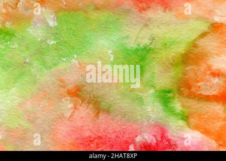 Colorful watercolor texture. Abstract hand-drawn background in vibrant red, green and yellow colors. Stock Photo