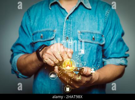 Man using mobile phone showing AI technology icon controlling data network system Stock Photo