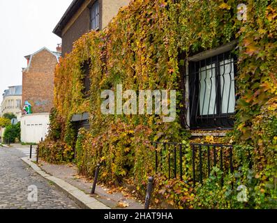 Paris, France - November 15th 2021: Green wall of a residential building in a quiet housing area Stock Photo