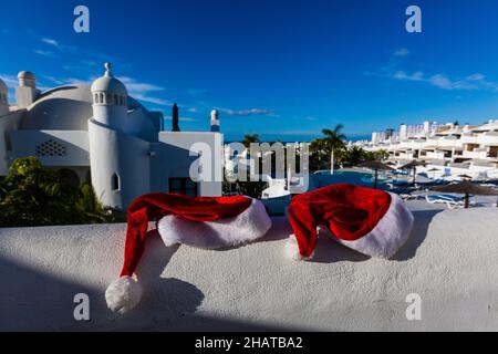 Santa hat near the swimming pool Stock Photo