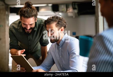 Multiethnic group of happy business people working together in office Stock Photo