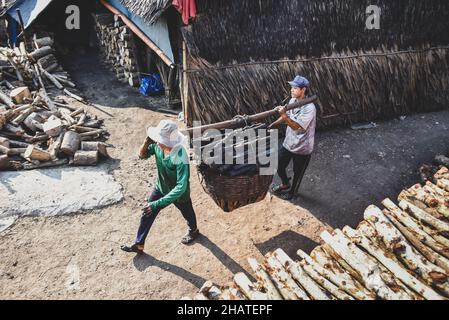 Coal furnace workers prepare to deliver goods to the market Stock Photo