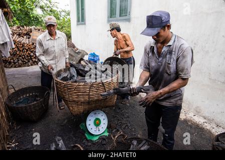 Coal furnace workers prepare to deliver goods to the market Stock Photo