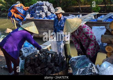 Coal furnace workers prepare to deliver goods to the market Stock Photo