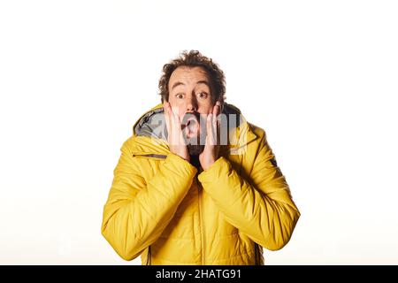half-length front portrait on white isolated studio background. emotional surprised bearded man  Stock Photo