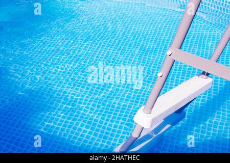 Banner. Plastic white staircase in prefabricated pool.  Stock Photo