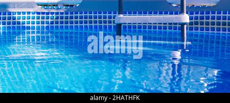 Banner. Plastic white staircase in prefabricated pool.  Stock Photo