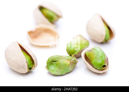 pistachio, pistachios, shell, shells, pistachio nuts, some, open, salted, green, white, background, close, closeup, close-up, many, lying, peeled, ins Stock Photo
