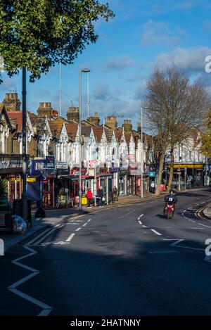 A row of houses and shops on Hoe Street, Walthamstow, London, England, UK Stock Photo