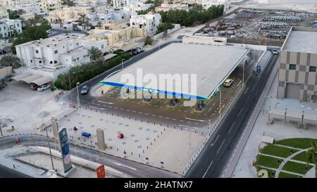 doha,qatar -05 December 2021 : bird view of one of the woqod petrol station in the busy city doha. Stock Photo