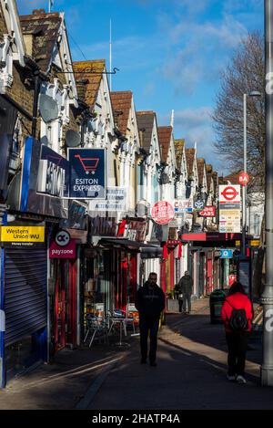 A row of houses and shops on Hoe Street, Walthamstow, London, England, UK Stock Photo