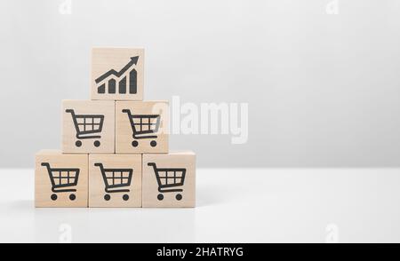 Retail sales growth. Sales volume increase, business growth or increase profit concept. cube with icon growing graph and shopping cart symbol. sale vo Stock Photo