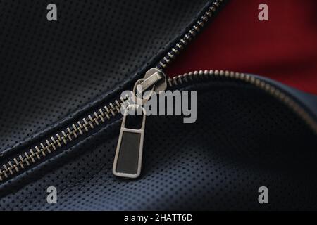 Closeup of zipper on blue leather jacket Stock Photo