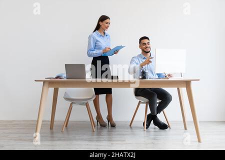 Portrait Of Smiling Colleagues Working At Office Together Stock Photo