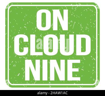 ON CLOUD NINE, text written on green vintage stamp sign Stock Photo