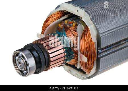 Rotor and stator detail of electric DC motor isolated on white background. Steel ball bearing, copper commutator and electromagnetic coil wire winding. Stock Photo
