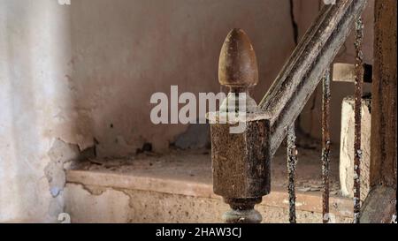 Staircase with banister knob in abandoned house, walls with crumbling paint and banister, Lost Place, Andalucia, Spain Stock Photo