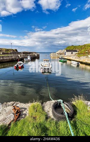 Fishing boats in the harbour, Ballintoy Harbour, Antrim, Northern Ireland, Great Britain Stock Photo