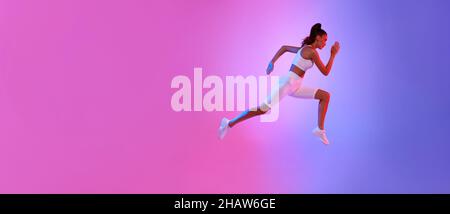 Sporty Female Running In Mid-Air Exercising Over Neon Background, Panorama Stock Photo