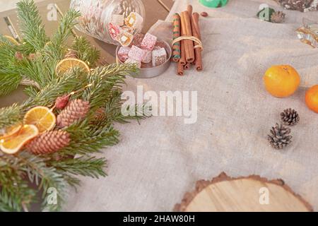Beautiful natural spruce wreath on a fabric tablecloth Stock Photo
