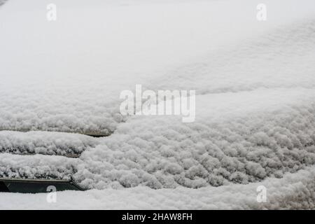 Snow covered car. Fresh snow on car in cold winter morning. Concept of driving in winter time with snow on road. Winter season. Copy space. Stock Photo