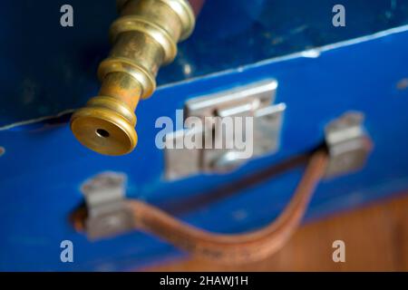 Vintage telescope on a blue suitcase Stock Photo
