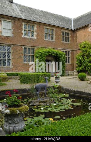 Sculpture of a fawn in a lily pond in the garden in front of Hellens House, Much Markle, Herts. UK