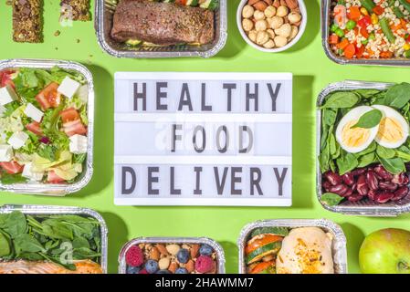 Healthy catering menu, courier food delivery lunch boxes. Beef steak meat, chicken filet , fish and vegetables in packages. Daily meal diet plan deliv Stock Photo