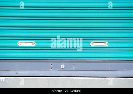Old used metal sheet, Slide door, Roller shutter texture security background. Stock Photo