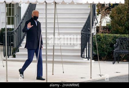washington, DC, US, 15/12/2021, United States President Joe Biden waves to the media as he walks toward Marine One en route to Joint Base Andrews where he will depart to Fort Campbell, Kentucky and then on to Mayfield and Dawson Springs, Kentucky to survey storm damage following extreme weather events at the White House in Washington, DC on Wednesday, December 15, 2021. A series of storms hit states across the Midwest and the South leaving entire communities in Kentucky destroyed. Credit: Leigh Vogel/Pool via CNP /MediaPunch Stock Photo