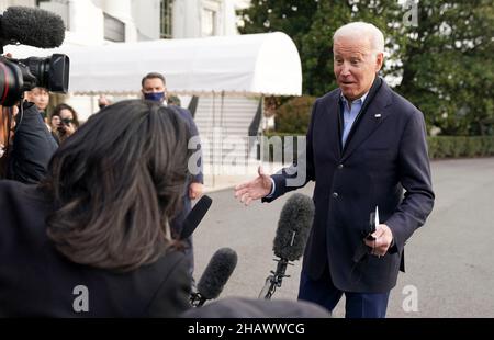 United States President Joe Biden speaks to media as he walks toward Marine One en route to Joint Base Andrews where he will depart to Fort Campbell, Kentucky and then on to Mayfield and Dawson Springs, Kentucky to survey storm damage following extreme weather events at the White House in Washington, DC on Wednesday, December 15, 2021. A series of storms hit states across the Midwest and the South leaving entire communities in Kentucky destroyed. Credit: Leigh Vogel/Pool via CNP Stock Photo
