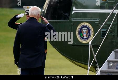 United States President Joe Biden salutes the Marine Guard as he walks toward Marine One en route to Joint Base Andrews where he will depart to Fort Campbell, Kentucky and then on to Mayfield and Dawson Springs, Kentucky to survey storm damage following extreme weather events at the White House in Washington, DC on Wednesday, December 15, 2021. A series of storms hit states across the Midwest and the South leaving entire communities in Kentucky destroyed. Credit: Leigh Vogel/Pool via CNP Stock Photo