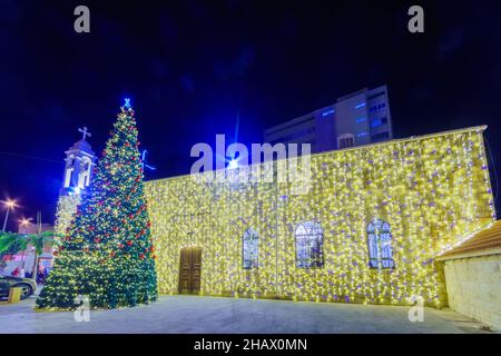 View of the Greek-catholic St. Elijah Cathedral (St. Elias Greek-Melkite, Mar-Elias), with Christmas Tree and holiday decorations, in downtown Haifa, Stock Photo